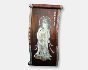 Vietnamese lacquer scroll titled "Divine Elegance," featuring a detailed mother of pearl inlay of Guan Yin, the Buddhist Goddess of Compassion, against a dark lacquer background with decorative borders.