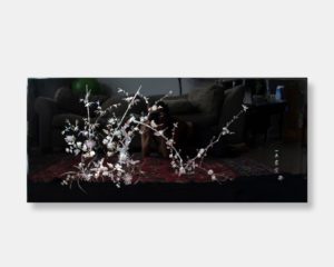 Vietnamese lacquer tabletop titled "Elegant Blossoms," featuring intricate mother of pearl inlay depicting blooming flowers and branches against a dark lacquer background, with Chinese writing and a logo signature.