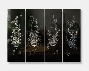 Set of four Vietnamese lacquer art panels titled "Ornamental Blossoms," featuring intricate mother of pearl inlay with floral arrangements on a dark lacquer background. Each panel measures 40x120 cm.