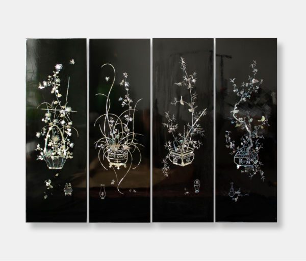 Set of four Vietnamese lacquer art panels titled "Ornamental Blossoms," featuring intricate mother of pearl inlay with floral arrangements on a dark lacquer background. Each panel measures 40x120 cm.