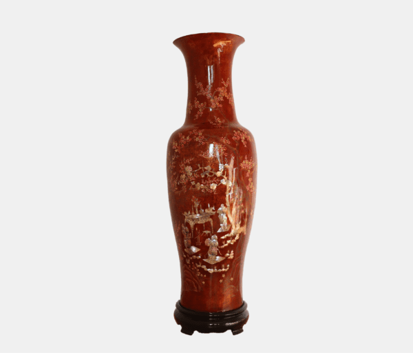 Salmon pink coloured antique Vietnamese lacquer vase titled "Majestic Ritual," featuring detailed mother of pearl inlay depicting a ritual scene with three bearded men around an offerings table amidst natural landscapes.