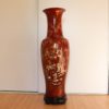 Salmon pink coloured antique Vietnamese lacquer vase titled "Majestic Ritual," featuring detailed mother of pearl inlay depicting a ritual scene with three bearded men around an offerings table amidst natural landscapes.